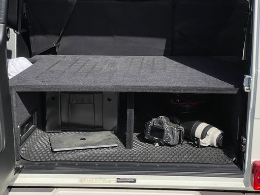 Gwagen W463 rear cargo storage sleeping platform hide your valuables black carpet